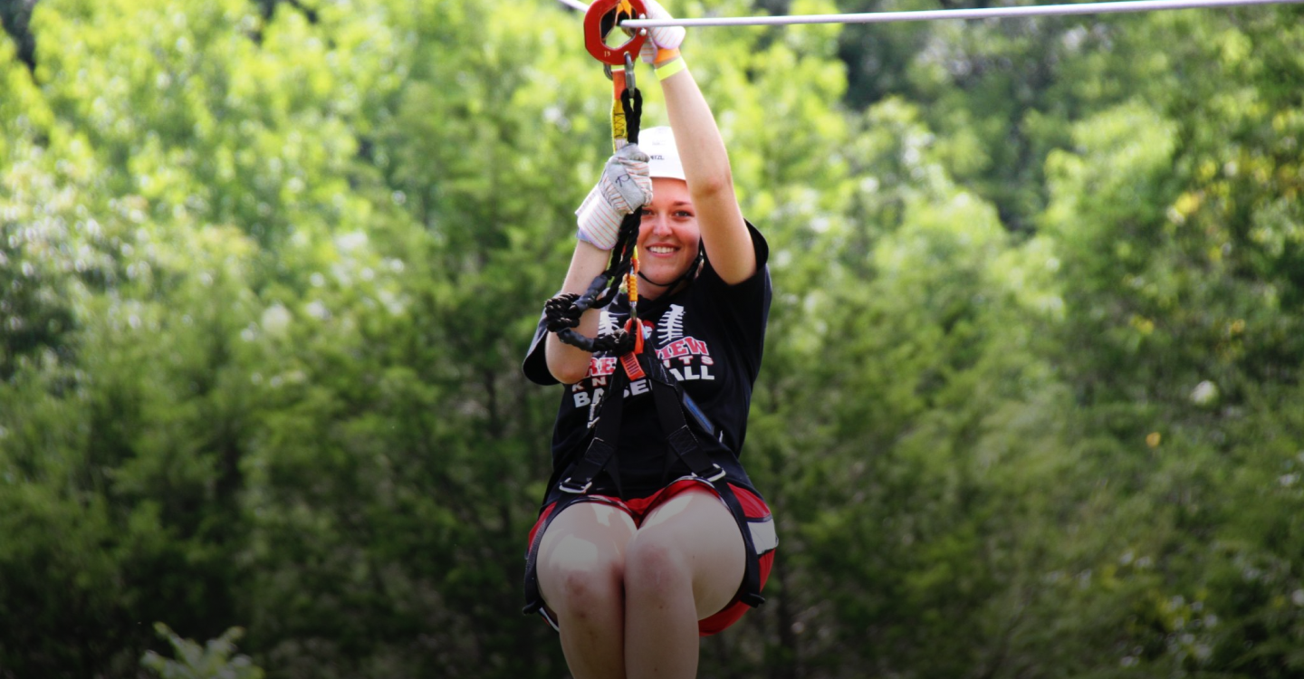 person smiling for the camera while on a zipline Kentucky