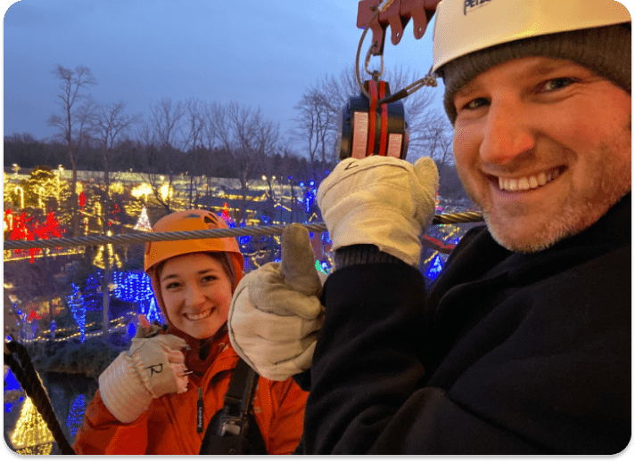 people doing a zip line at Creation Museum Christmas Town