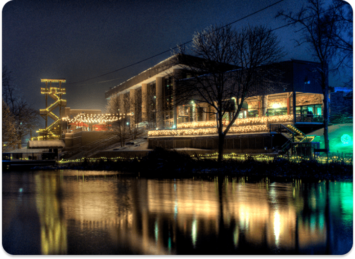 Buildings lit up at night at Christmas Town