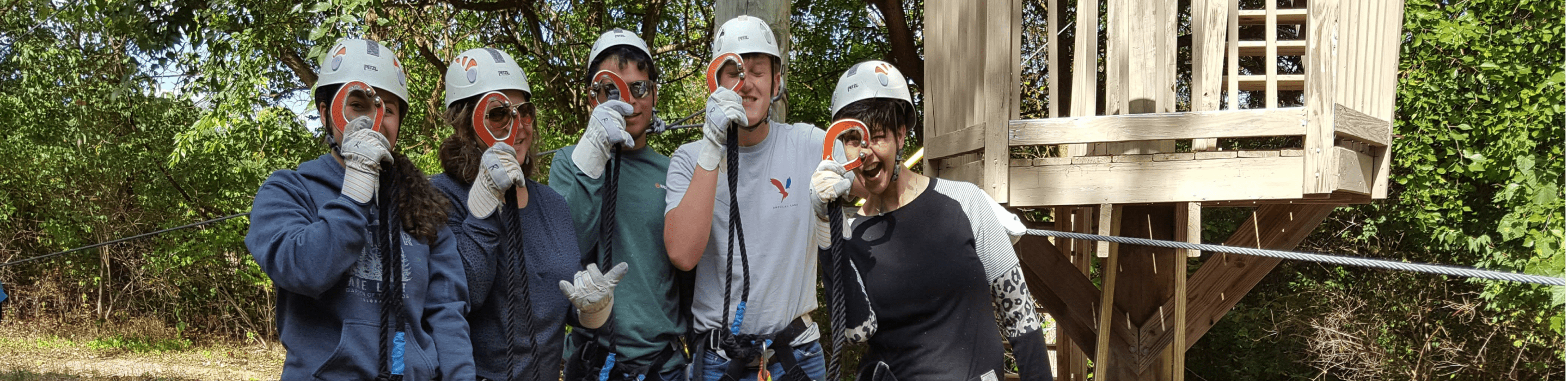 People posing for the camera before starting a team building activity